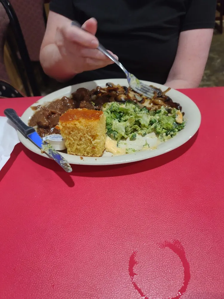 Beef Tips Smothered in Gravy with Cheese on Top of Broccoli and Sauteed Mushrooms